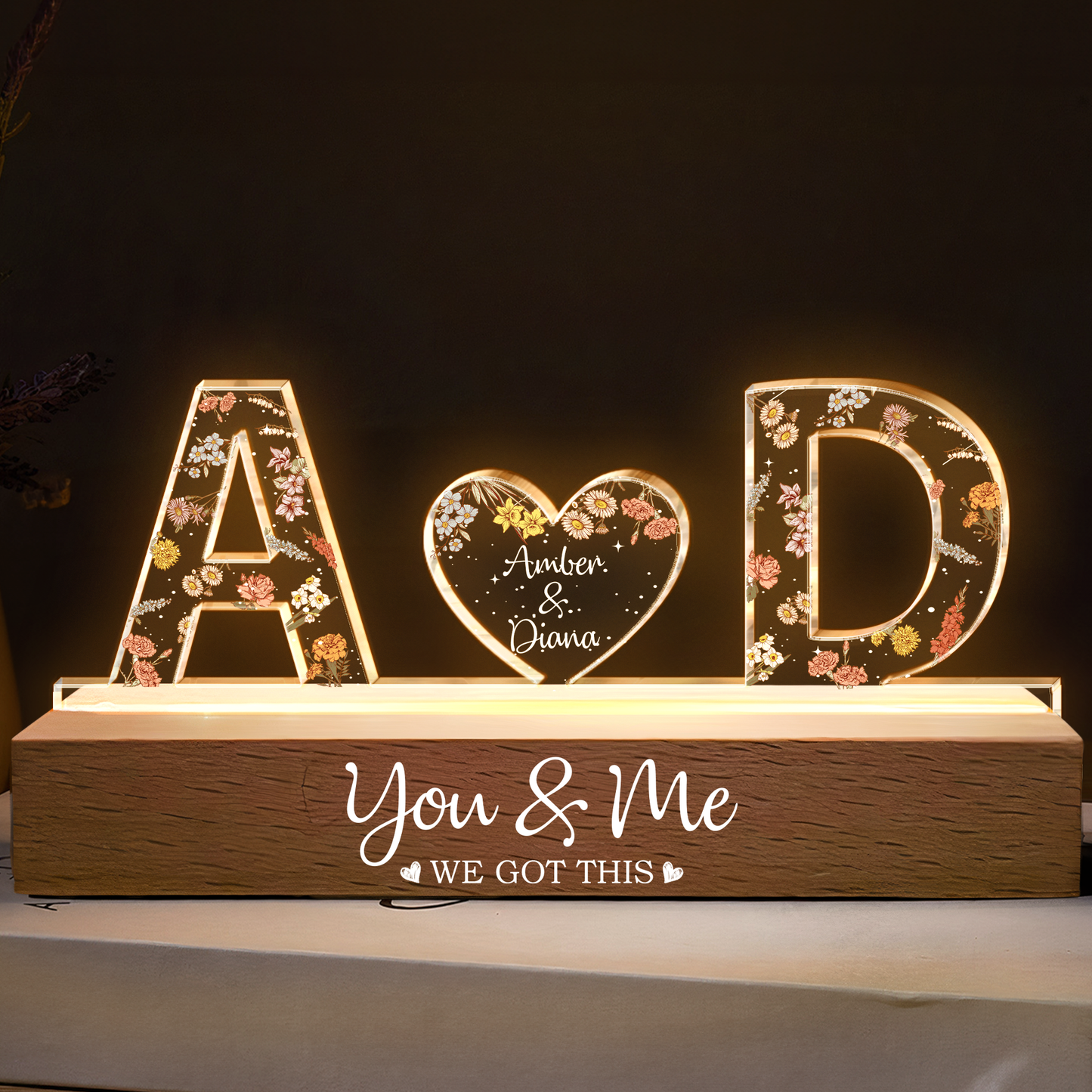 Custom LED lamp with floral initials A and D and heart engraved with Amber & Diana.
