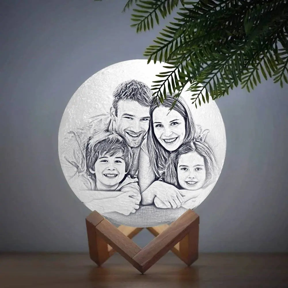Engraved photo lamp with custom family portrait, beautifully illuminated in a cozy setting.