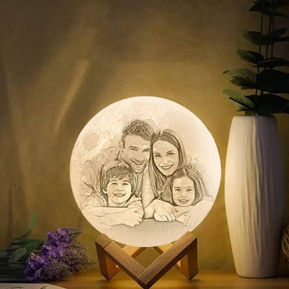 Hand holding a custom photo moon lamp featuring a couple’s embrace, romantic gift lighting.