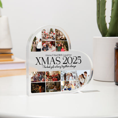 Heart-shaped photo collage display with 'XMAS 2025' text on a white surface.