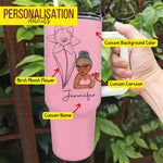 White tumbler with black floral art and a cartoon girl holding a cup, customized with the name “Jessica.”