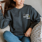 Anti Social Club sweatshirt folded and held