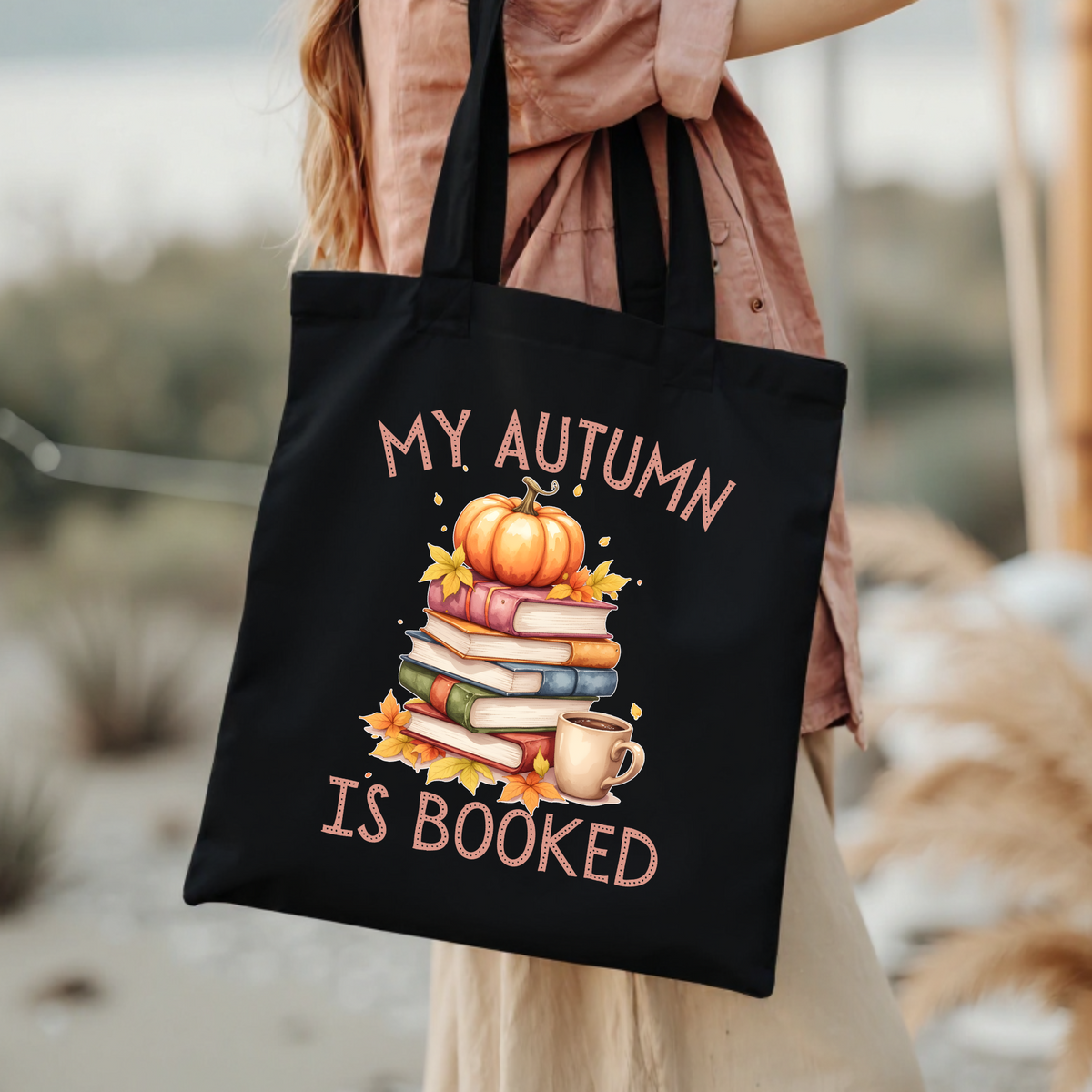 Bookish Canvas tote bag carried by hand