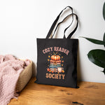 Cozy Reader Society Book tote bag shown in a lifestyle setting