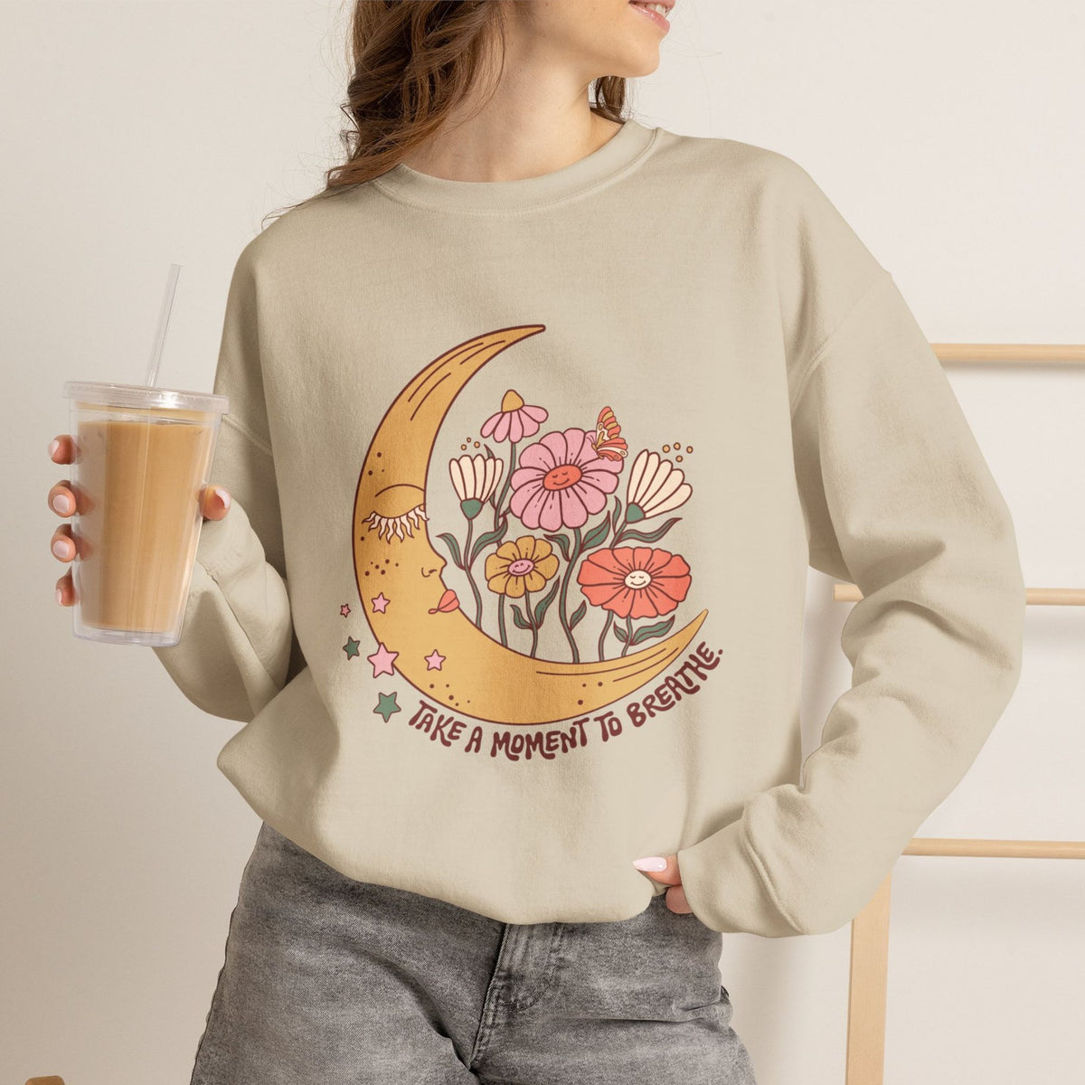 Floral sweatshirt folded and held