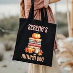 Personalised Pumpkin Book Stack tote bag carried by hand