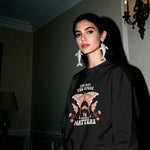 Self Love sweatshirt folded and held